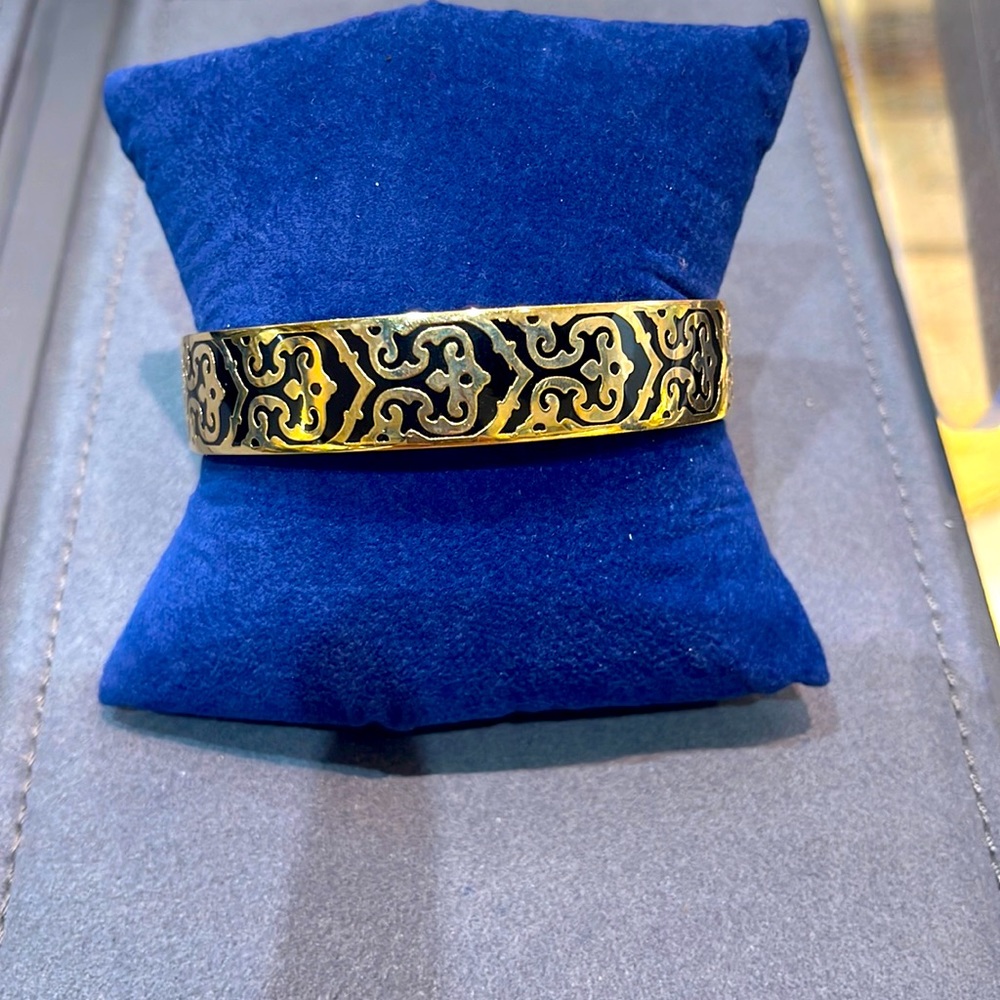 Gold tone C wonder Bangle